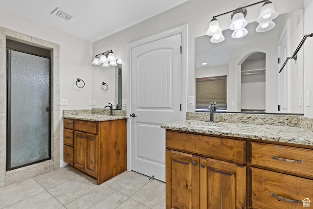 3345 W 2430 S, Hurricane, UT 84737 - bathroom with tile patterned flooring, two vanities, and a shower stall