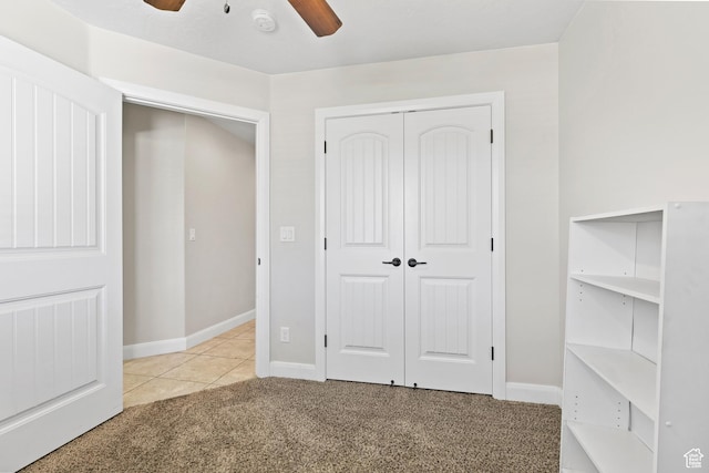 3345 W 2430 S, Hurricane, UT 84737 - unfurnished bedroom featuring carpet floors, a closet, ceiling fan, baseboards, and tile patterned floors
