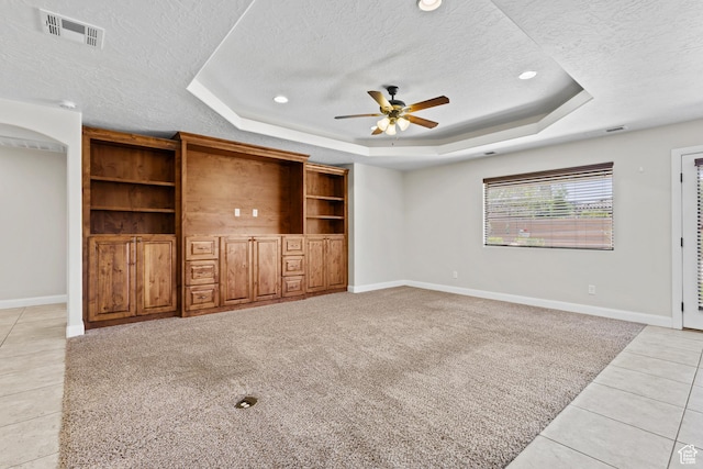 3345 W 2430 S, Hurricane, UT 84737 - unfurnished living room featuring a raised ceiling, a textured ceiling, a ceiling fan, baseboards, and recessed lighting
