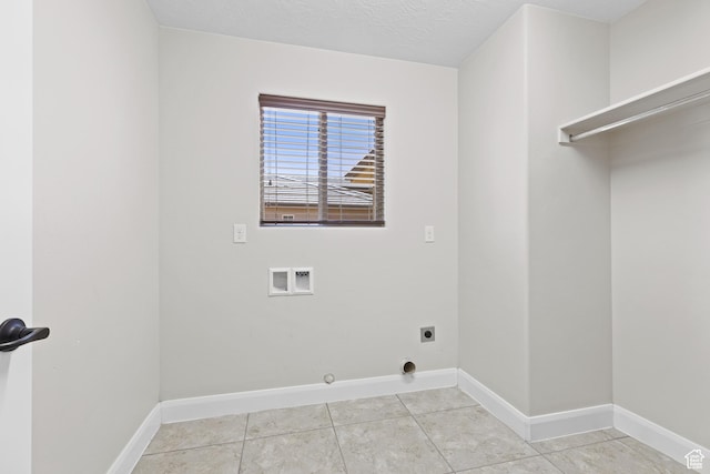 3345 W 2430 S, Hurricane, UT 84737 - laundry room with hookup for an electric dryer, hookup for a washing machine, baseboards, light tile patterned flooring, and hookup for a gas dryer