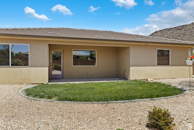 3345 W 2430 S, Hurricane, UT 84737 - rear view of house featuring a patio and a yard