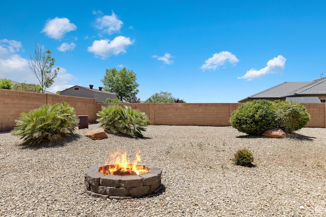 3345 W 2430 S, Hurricane, UT 84737 - fenced backyard featuring an outdoor fire pit