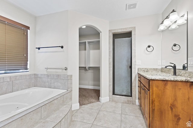 3345 W 2430 S, Hurricane, UT 84737 - bathroom with a stall shower, vanity, a spacious closet, and a whirlpool tub