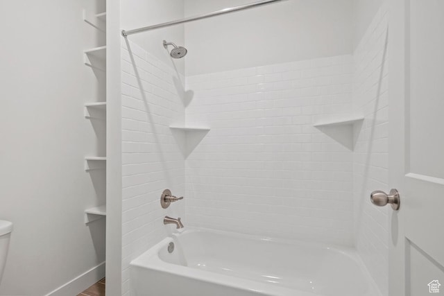 11433 S Watercourse Rd Unit 184, South Jordan, UT 84009 - bathroom featuring shower / tub combination, toilet, and baseboards