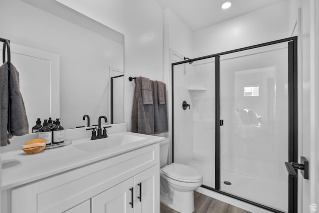 1687 S Ripple Rock Dr Unit 3013, Washington, UT 84780 - bathroom featuring a shower stall, vanity, toilet, and wood finished floors