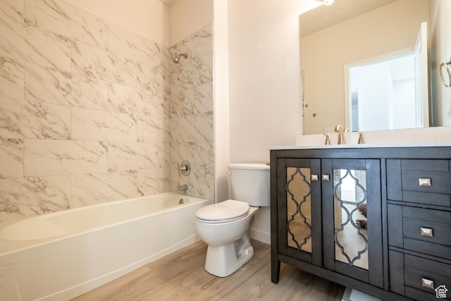 10227 S Oquirrh Lake Rd, South Jordan, UT 84095 - bathroom with wood finished floors, toilet, vanity, shower / tub combination, and baseboards