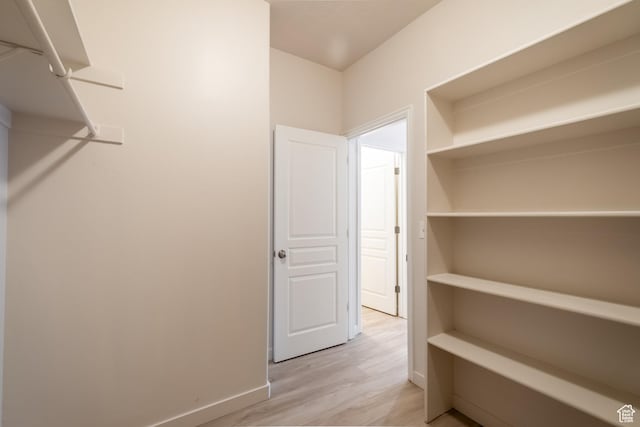 10227 S Oquirrh Lake Rd, South Jordan, UT 84095 - walk in closet with light wood-type flooring