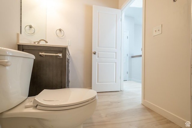 10227 S Oquirrh Lake Rd, South Jordan, UT 84095 - bathroom featuring wood finished floors, vanity, and baseboards