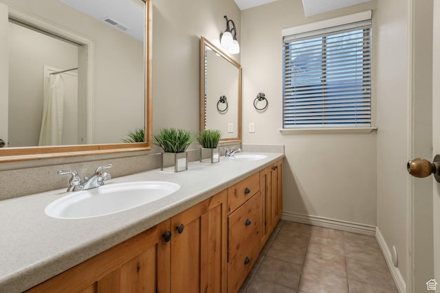 584 S Silver Ln, Alpine, UT 84004 - bathroom with double vanity, tile patterned floors, and baseboards