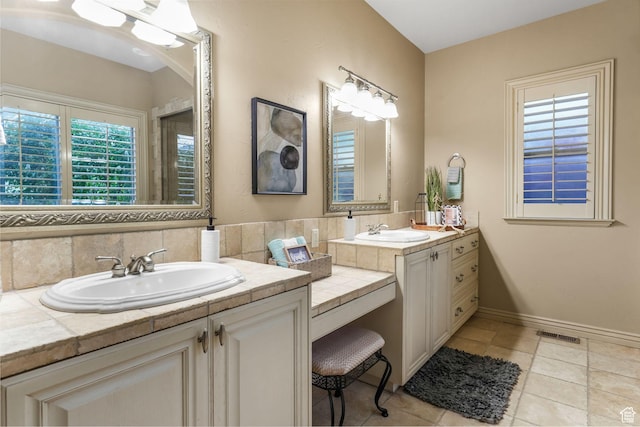 584 S Silver Ln, Alpine, UT 84004 - full bath with two vanities, backsplash, baseboards, and tile patterned flooring