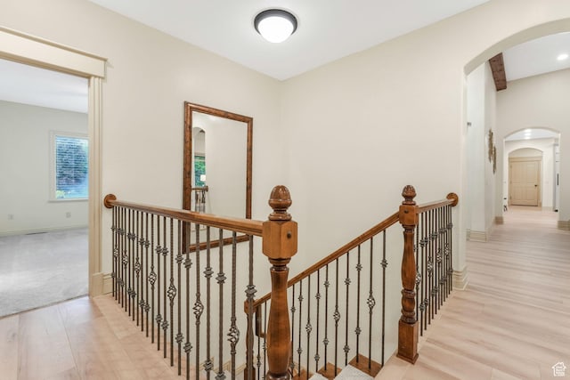 584 S Silver Ln, Alpine, UT 84004 - corridor featuring wood finished floors, an upstairs landing, arched walkways, and baseboards