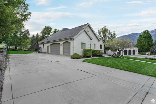 584 S Silver Ln, Alpine, UT 84004 - view of property exterior featuring concrete driveway, a yard, a garage, a mountain view, and brick siding