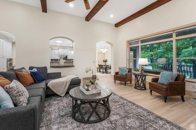 584 S Silver Ln, Alpine, UT 84004 - living area with arched walkways, light wood-style floors, beam ceiling, a ceiling fan, and recessed lighting