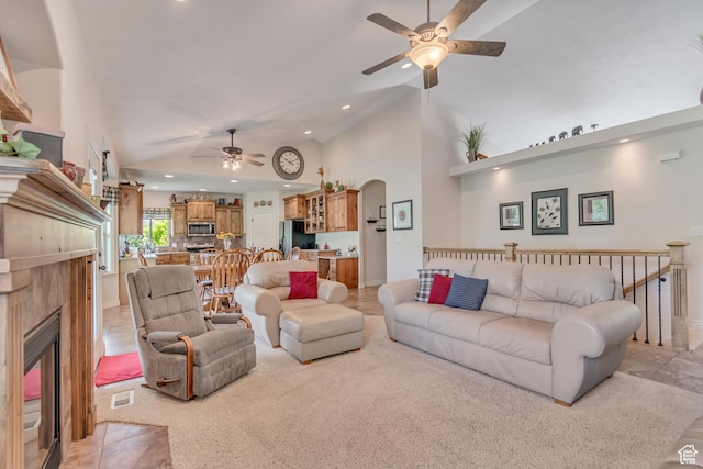 3028 W Viola Ln, Riverton, UT 84065 - living room with ceiling fan, a fireplace, arched walkways, recessed lighting, and high vaulted ceiling