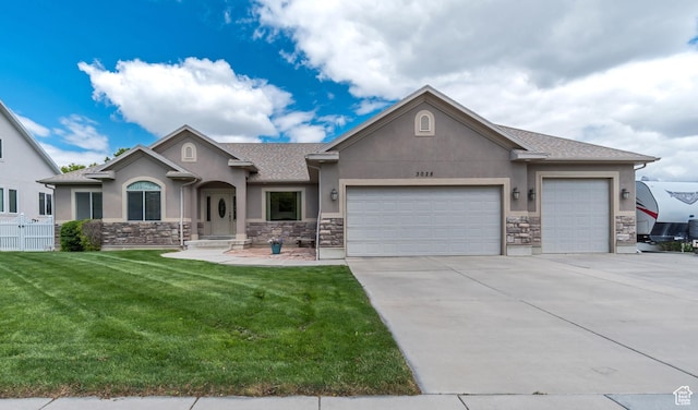 3028 W Viola Ln, Riverton, UT 84065 - view of front of property with stucco siding, stone siding, a garage, and concrete driveway