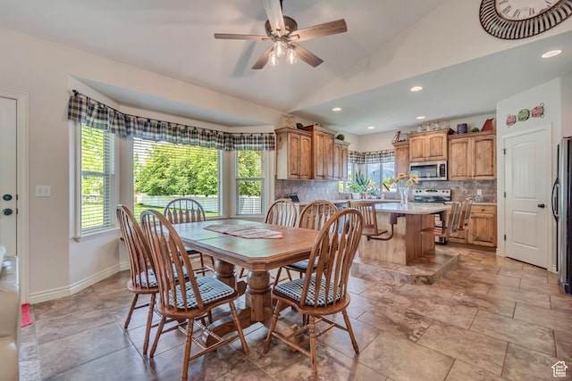 3028 W Viola Ln, Riverton, UT 84065 - dining space with healthy amount of natural light, vaulted ceiling, a ceiling fan, recessed lighting, and baseboards