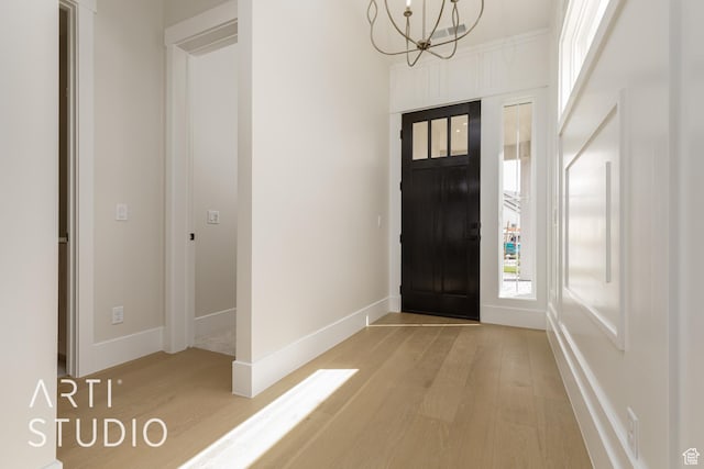 2921 E Yavin Way, St George, UT 84790 - foyer entrance with light wood-style floors, a chandelier, healthy amount of natural light, and baseboards