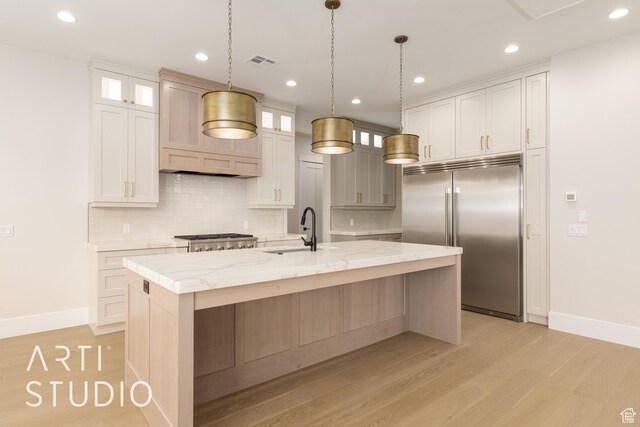 2921 E Yavin Way, St George, UT 84790 - kitchen with built in fridge, a sink, decorative backsplash, baseboards, and recessed lighting