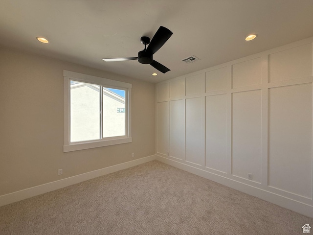 2921 E Yavin Way, St George, UT 84790 - empty room with a decorative wall, a ceiling fan, recessed lighting, light carpet, and baseboards