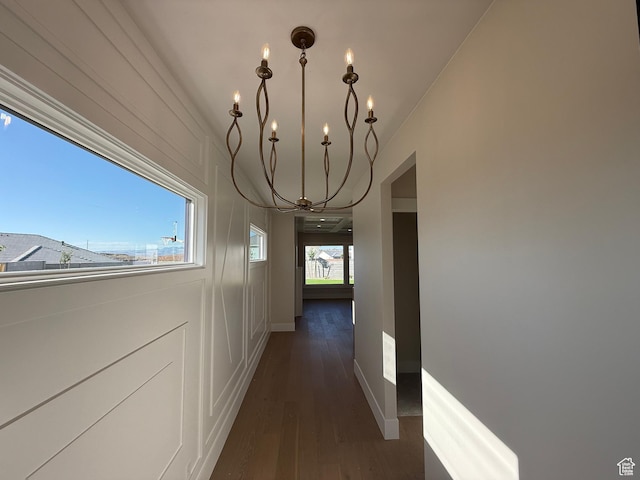 2921 E Yavin Way, St George, UT 84790 - hallway with a chandelier, dark wood-type flooring, and baseboards