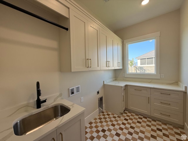 2921 E Yavin Way, St George, UT 84790 - laundry room with cabinet space, hookup for a washing machine, hookup for an electric dryer, light floors, and baseboards