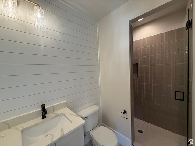 2921 E Yavin Way, St George, UT 84790 - bathroom with a stall shower, toilet, wood walls, and vanity