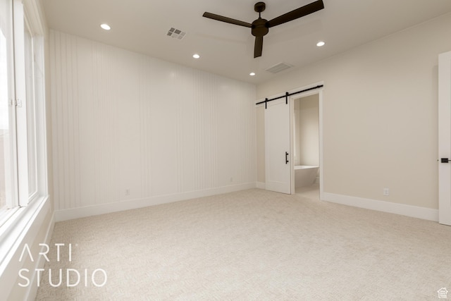 2921 E Yavin Way, St George, UT 84790 - empty room with a ceiling fan, carpet floors, recessed lighting, a barn door, and baseboards