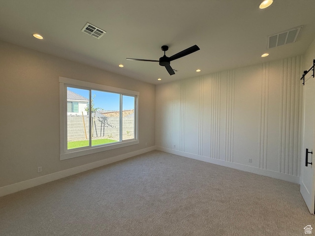 2921 E Yavin Way, St George, UT 84790 - spare room featuring a ceiling fan, recessed lighting, carpet, and baseboards
