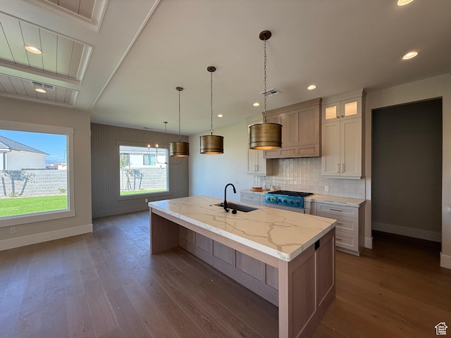 2921 E Yavin Way, St George, UT 84790 - kitchen with a sink, baseboards, dark wood-type flooring, an island with sink, and backsplash