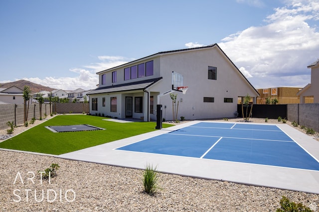 2921 E Yavin Way, St George, UT 84790 - back of house with basketball court, stucco siding, and uncovered parking