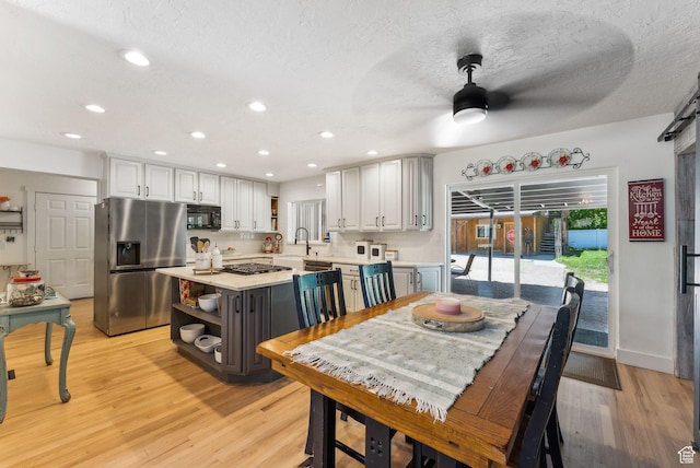 623 N 120 W, Lehi, UT 84043 - dining room featuring a ceiling fan, light wood-style flooring, recessed lighting, a textured ceiling, and baseboards