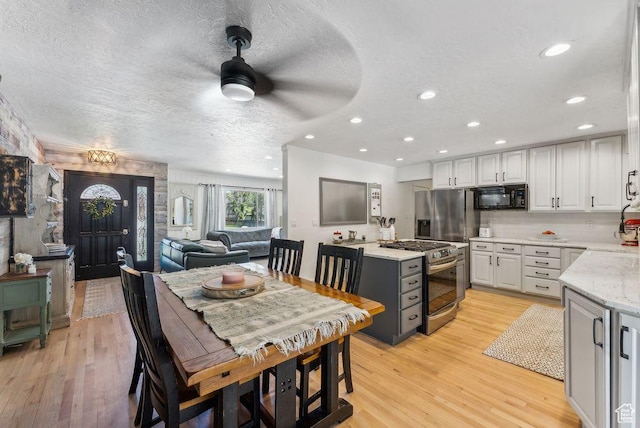 623 N 120 W, Lehi, UT 84043 - dining area with light wood-style flooring, a textured ceiling, recessed lighting, and ceiling fan