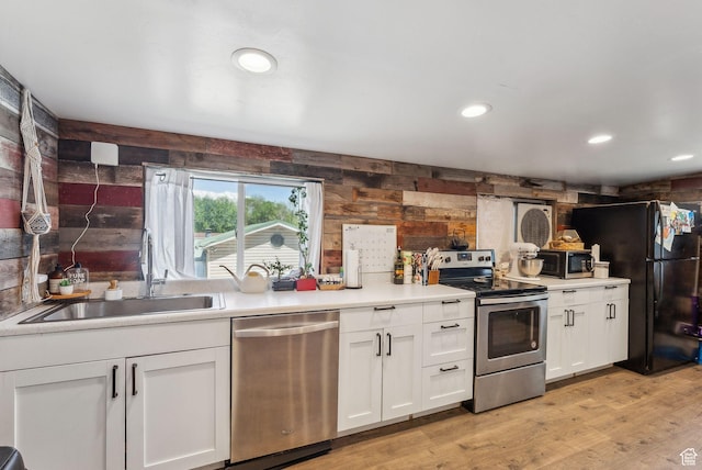623 N 120 W, Lehi, UT 84043 - kitchen featuring appliances with stainless steel finishes, a sink, white cabinets, light countertops, and light wood-type flooring