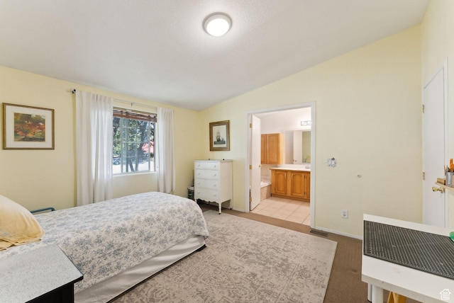 245 S 400 W, Heber City, UT 84032 - bedroom with vaulted ceiling, ensuite bath, and baseboards
