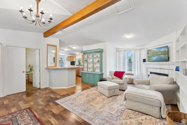 245 S 400 W, Heber City, UT 84032 - living area with wood finished floors, a tiled fireplace, a chandelier, and baseboards