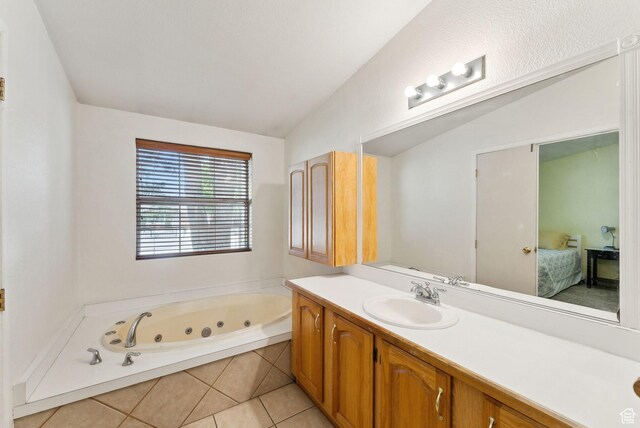 245 S 400 W, Heber City, UT 84032 - ensuite bathroom with vanity, a tub with jets, vaulted ceiling, and tile patterned flooring