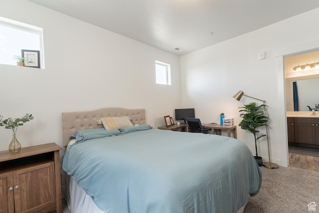 1994 N 3330 W Unit A304, Lehi, UT 84043 - carpeted bedroom featuring connected bathroom and baseboards