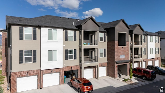 1994 N 3330 W Unit A304, Lehi, UT 84043 - view of building exterior featuring a garage and driveway