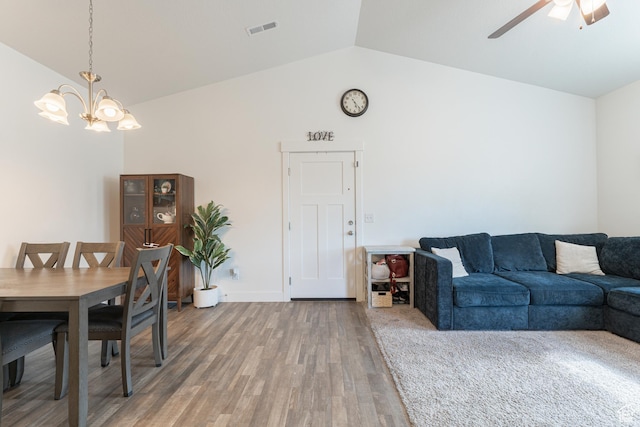 1994 N 3330 W Unit A304, Lehi, UT 84043 - dining area with vaulted ceiling, a chandelier, light wood-style floors, and a ceiling fan