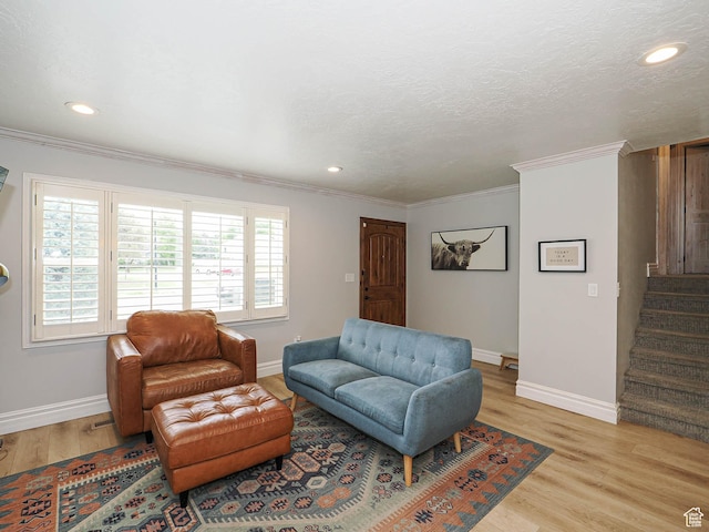 8701 S 1365 W, West Jordan, UT 84088 - living area with light wood-style floors, baseboards, crown molding, stairs, and recessed lighting