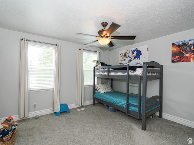 8701 S 1365 W, West Jordan, UT 84088 - carpeted bedroom with baseboards, a textured ceiling, and a ceiling fan