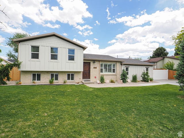 8701 S 1365 W, West Jordan, UT 84088 - split level home with board and batten siding and brick siding