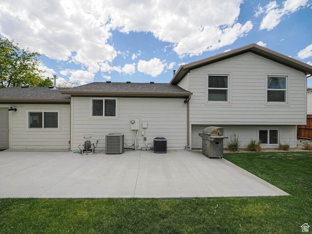8701 S 1365 W, West Jordan, UT 84088 - back of property with a lawn, a patio area, and central AC