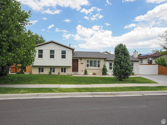 8701 S 1365 W, West Jordan, UT 84088 - tri-level home with brick siding, board and batten siding, and roof with shingles