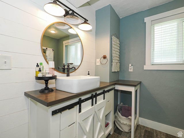8701 S 1365 W, West Jordan, UT 84088 - bathroom with wood finished floors, vanity, and baseboards