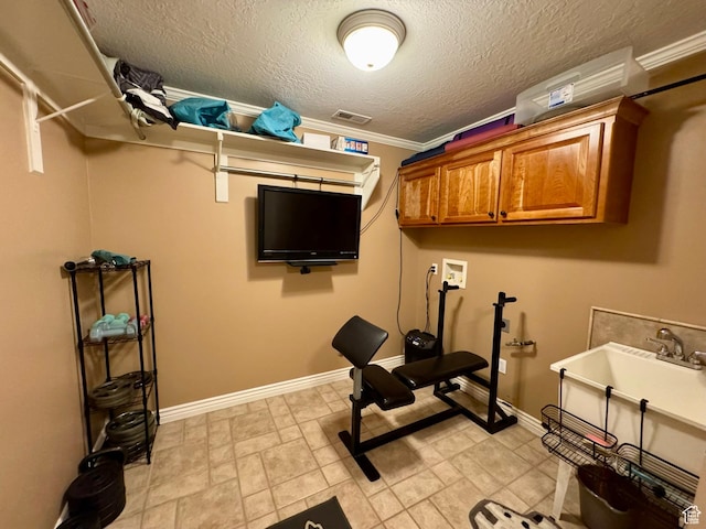 1710 N 2625 E, Layton, UT 84040 - workout area featuring baseboards, a textured ceiling, and ornamental molding