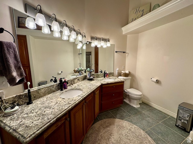 1710 N 2625 E, Layton, UT 84040 - bathroom with toilet, double vanity, baseboards, and tile patterned floors