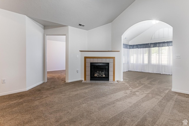 544 W 300 S Unit C, Springville, UT 84663 - unfurnished living room featuring carpet floors, lofted ceiling, a fireplace, and baseboards