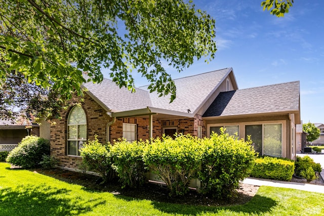 544 W 300 S Unit C, Springville, UT 84663 - view of front facade featuring brick siding, a front lawn, and roof with shingles