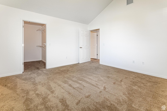 544 W 300 S Unit C, Springville, UT 84663 - unfurnished bedroom with carpet flooring, a spacious closet, baseboards, and high vaulted ceiling